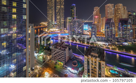 Dubai Marina skyscrapers and JBR district with luxury buildings and resorts aerial day to night timelapse 105797105