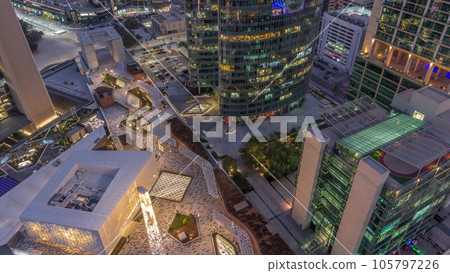 Dubai international financial center skyscrapers aerial day to night timelapse. Dubai international financial center skyscrapers aerial day to night timelapse. 105797226