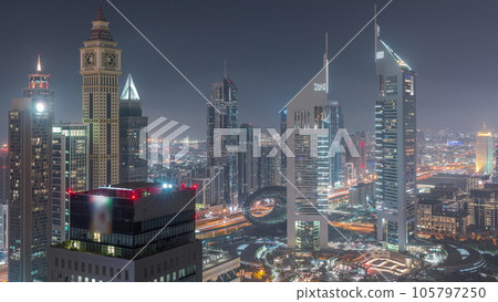 Skyscrapers on Sheikh Zayed Road and DIFC day to night in Dubai, UAE. Skyscrapers on Sheikh Zayed Road and DIFC day to night in Dubai, UAE. 105797250