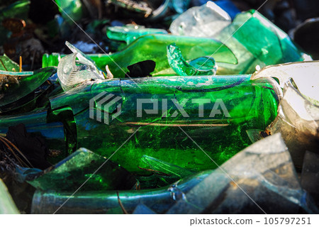 Broken glass bottles, landfill in the forest, pollution problem Broken glass bottles, landfill in the forest, pollution problem 105797251