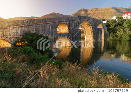 Trebinje, Old Bridge on Trebisnica River on Sunset 105797339