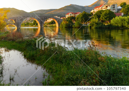 Trebinje, Old Bridge on Trebisnica River on Sunset 105797340