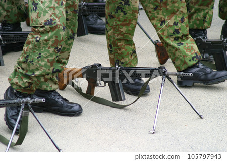 Type 64 rifle placed at the feet of a Ground Self-Defense Force member Type 64 rifle placed at the feet of a Ground Self-Defense Force member 105797943