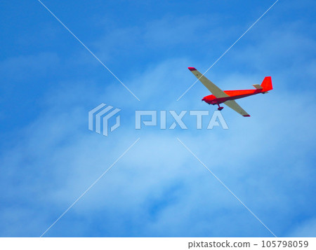 red glider flying in the sky red glider flying in the sky 105798059