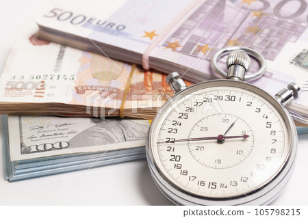 Time is money concept, stopwatch on euro ,dollars, Russian rubles banknotes Time is money concept, stopwatch on euro ,dollars, Russian rubles banknotes 105798215