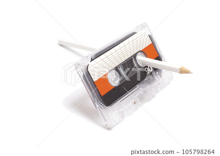 Audio cassette tape with pencil isolated on white background, vintage 80's music concept 105798264