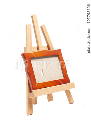 Artist wooden easel with a wooden blank frame isolated on white 105798396