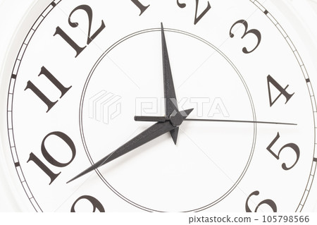 Closeup of hands on clock face. Closeup of hands on clock face. 105798566