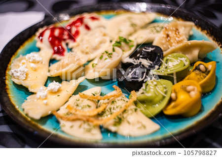Variety of different stuffed dumplings 105798827