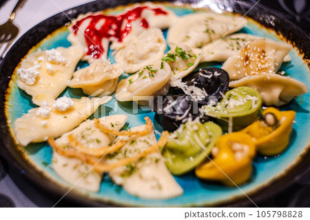 Variety of different stuffed dumplings 105798828