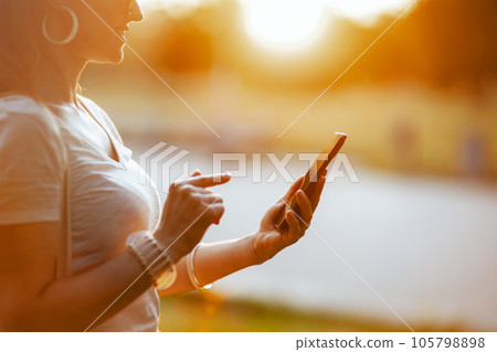 Closeup on woman in white shirt 105798898