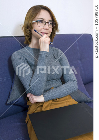 Portrait of a female psychotherapist with glasses. Close-up Portrait of a female psychotherapist with glasses. Close-up 105799710