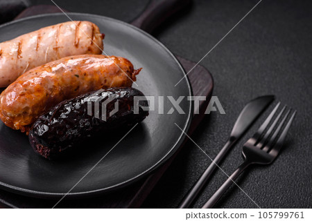 Delicious juicy sausages of several varieties grilled with salt, spices and herbs 105799761