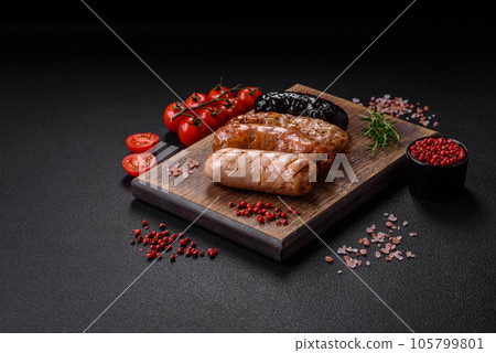 Delicious juicy sausages of several varieties grilled with salt, spices and herbs 105799801