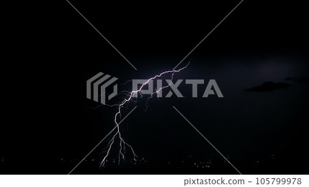 Night stormy sky over city. Beautiful lightning strike. Thundercloud 105799978