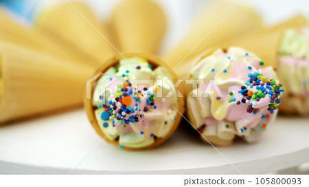 Candy bar on children's birthday. close-up, multi-colored lollipops, sweets, biscuit, cupcakes, sweet decoration for children's parties and children's anniversaries. 105800093