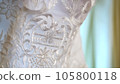 close-up, beautiful white lace on a dress, wedding dress 105800118