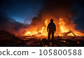 The fireman stands at the scene of the fire. 105800588