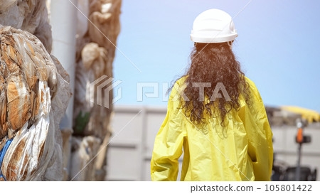Black-haired lady inspector explores waste sorting plant Black-haired lady inspector explores waste sorting plant 105801422