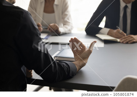 Hand of businessman talking to colleagues, partners, investors 105801874