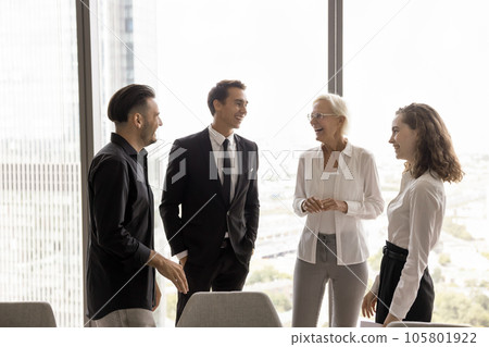 Happy business colleagues in formal clothes standing together Happy business colleagues in formal clothes standing together 105801922