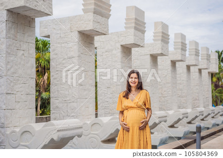 A strong and resilient woman over 40 embraces the beauty of childbirth in Mexico, celebrating the journey of motherhood with cultural richness A strong and resilient woman over 40 embraces the beauty of childbirth in Mexico, celebrating the journey of motherhood with cultural richness 105804369