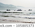 Boats floating near the beach in the brilliant dawn 105805373