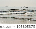 A boat floating on the sea in the brilliant dawn 105805375