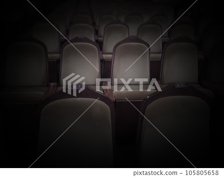 Two seats floating in the movie theater spotlights 105805658