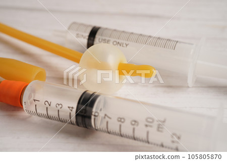 Foley catheter and urine drainage bag collect urine for disability or patient in hospital. Foley catheter and urine drainage bag collect urine for disability or patient in hospital. 105805870