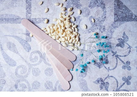 Wax for hair removal. Hair removal with wax. 105808521