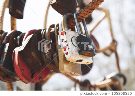Old padlock. Door lock in the form of a heart. 105808530