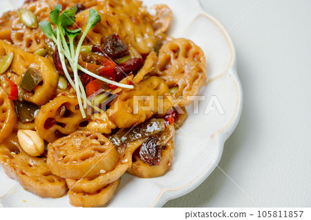 korean food yeongeunjorim, Braised Lotus Roots, Yeongeun (lotus root) parboiled and braised in a mixture of soy sauce and sugar over lower heat. Add syrup and braise to a glaze before serving. 105811857