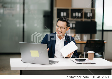 Attractive young lawyer in office Business man and lawyers discussing contract papers laptop and tablet with brass scale on  desk in modern office. Law, legal services, advice,.. 105812021