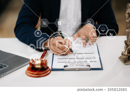 justice and law concept.Male judge in a courtroom the gavel, working with smart phone and laptop and digital tablet computer on wood table in morning light . justice and law concept.Male judge in a courtroom the gavel, working with smart phone and laptop and digital tablet computer on wood table in morning light . 105812083