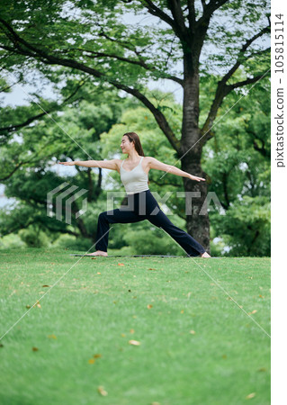 Woman doing warrior pose 2 in yoga outside Woman doing warrior pose 2 in yoga outside 105815114