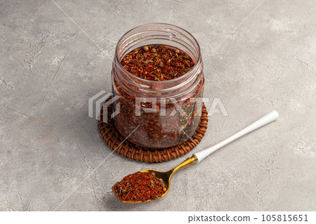 A set of spices on a light background in a glass bowl. Enhancement of taste. A set of spices on a light background in a glass bowl. Enhancement of taste. 105815651