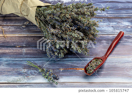 Bouquet of dried lavender, lavender soap, oil and candle tea. Healthy lifestyle, light background. Bouquet of dried lavender, lavender soap, oil and candle tea. Healthy lifestyle, light background. 105815747
