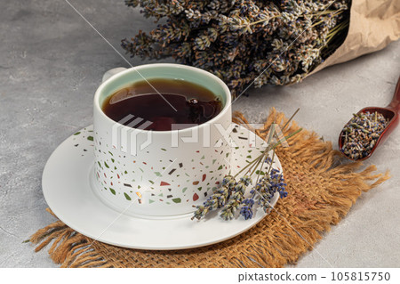 Bouquet of dried lavender, lavender soap, oil and candle tea. Healthy lifestyle, light background. Bouquet of dried lavender, lavender soap, oil and candle tea. Healthy lifestyle, light background. 105815750