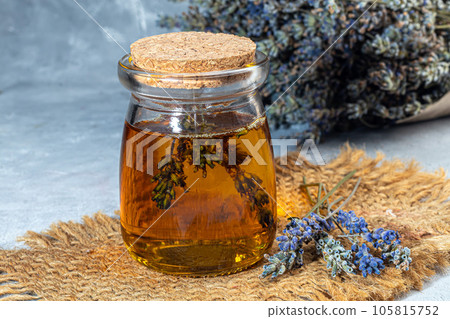 Bouquet of dried lavender, lavender soap, oil and candle tea. Healthy lifestyle, light background. Bouquet of dried lavender, lavender soap, oil and candle tea. Healthy lifestyle, light background. 105815752