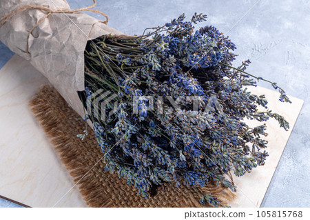 Bouquet of dried lavender, lavender soap, oil and candle tea. Healthy lifestyle, light background. Bouquet of dried lavender, lavender soap, oil and candle tea. Healthy lifestyle, light background. 105815768