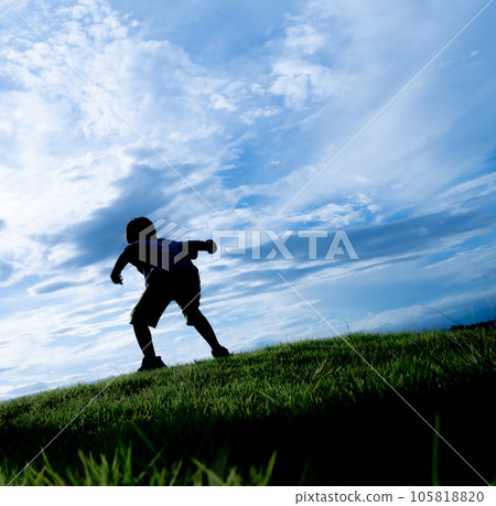 silhouette of a child playing in the meadow silhouette of a child playing in the meadow 105818820
