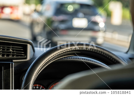 A man driving a car A man driving a car 105818841