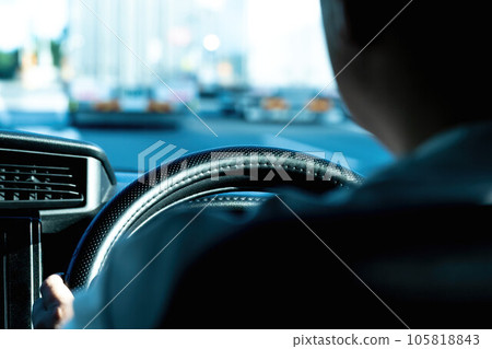 A man driving a car A man driving a car 105818843