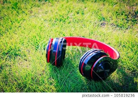 Natural music space: headphones on the lawn Natural music space: headphones on the lawn 105819236