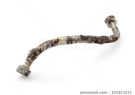 Damaged water hose with traces of corrosion, deformation of the protective layer and limescale isolated on a white background 105821031