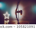 Young sexy woman in black lingerie pole dancing in dark interior 105821091