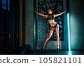 Young woman dancer in lingerie posing on wall background 105821101