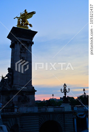 Evening view of the Seine River / Pont Alexandre III / Paris, France Evening view of the Seine River / Pont Alexandre III / Paris, France 105821437