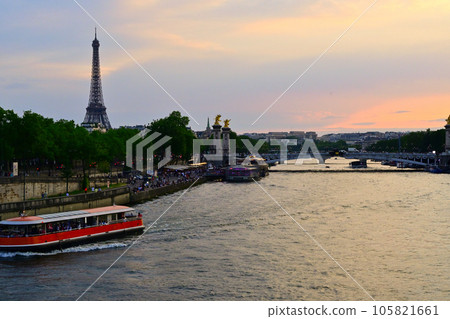Eiffel Tower in the evening seen from the Seine / Paris, France Eiffel Tower in the evening seen from the Seine / Paris, France 105821661